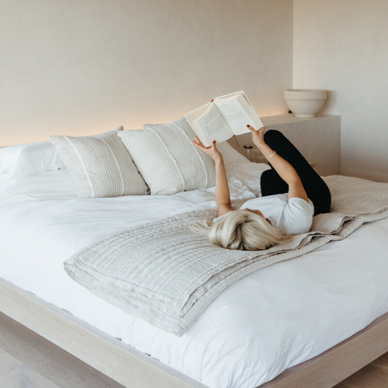remi ishizuka reading on bed